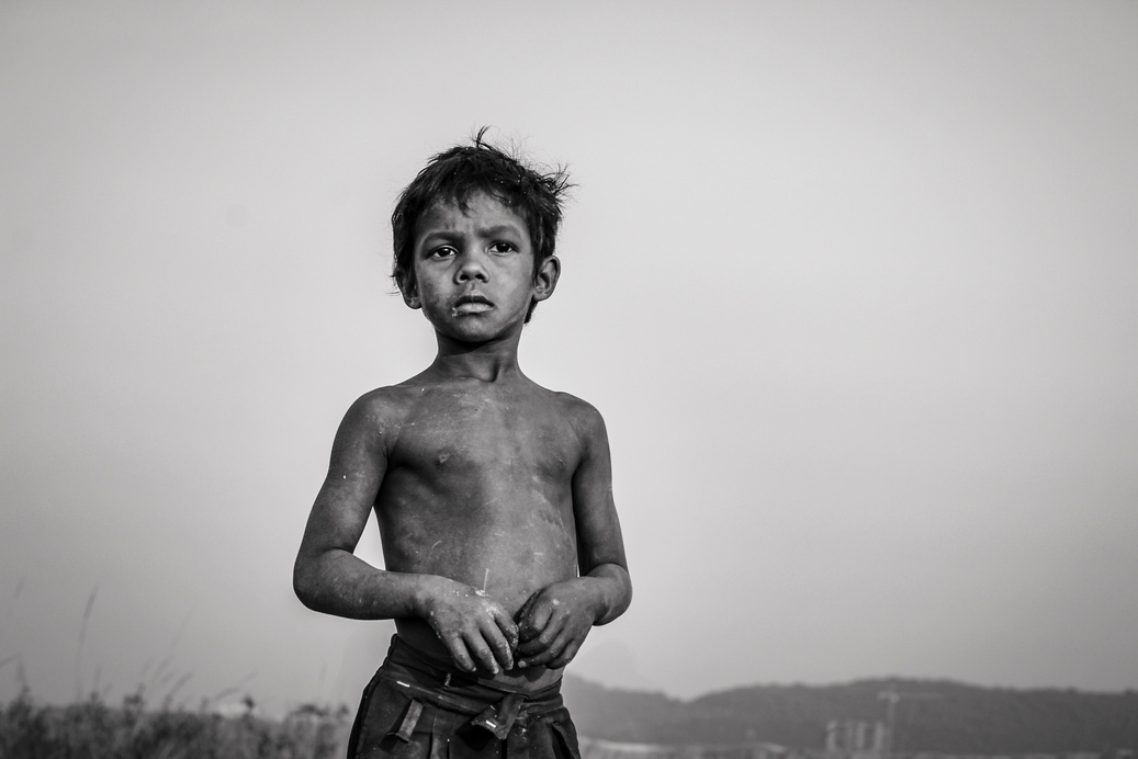 Grayscale Photo of a Dirty Shirtless Boy